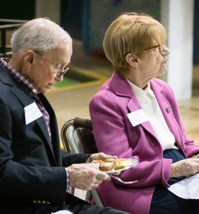 Dick and Liz Marshall, both honorary chairs of the campaign, listen as Ashlee Anderson addresses those in attendance.